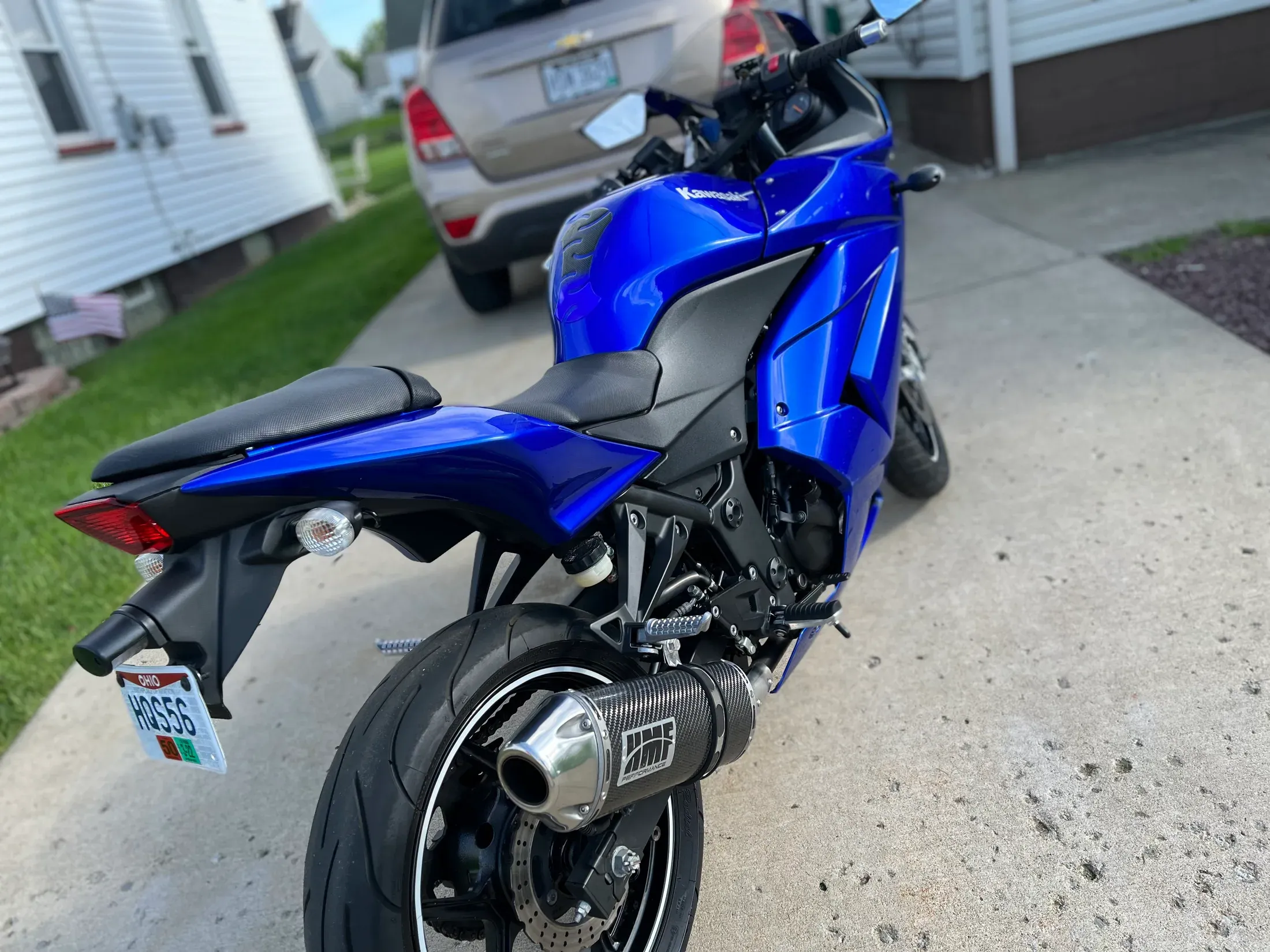 Detailed blue Kawasaki motorcycle viewed from the side.