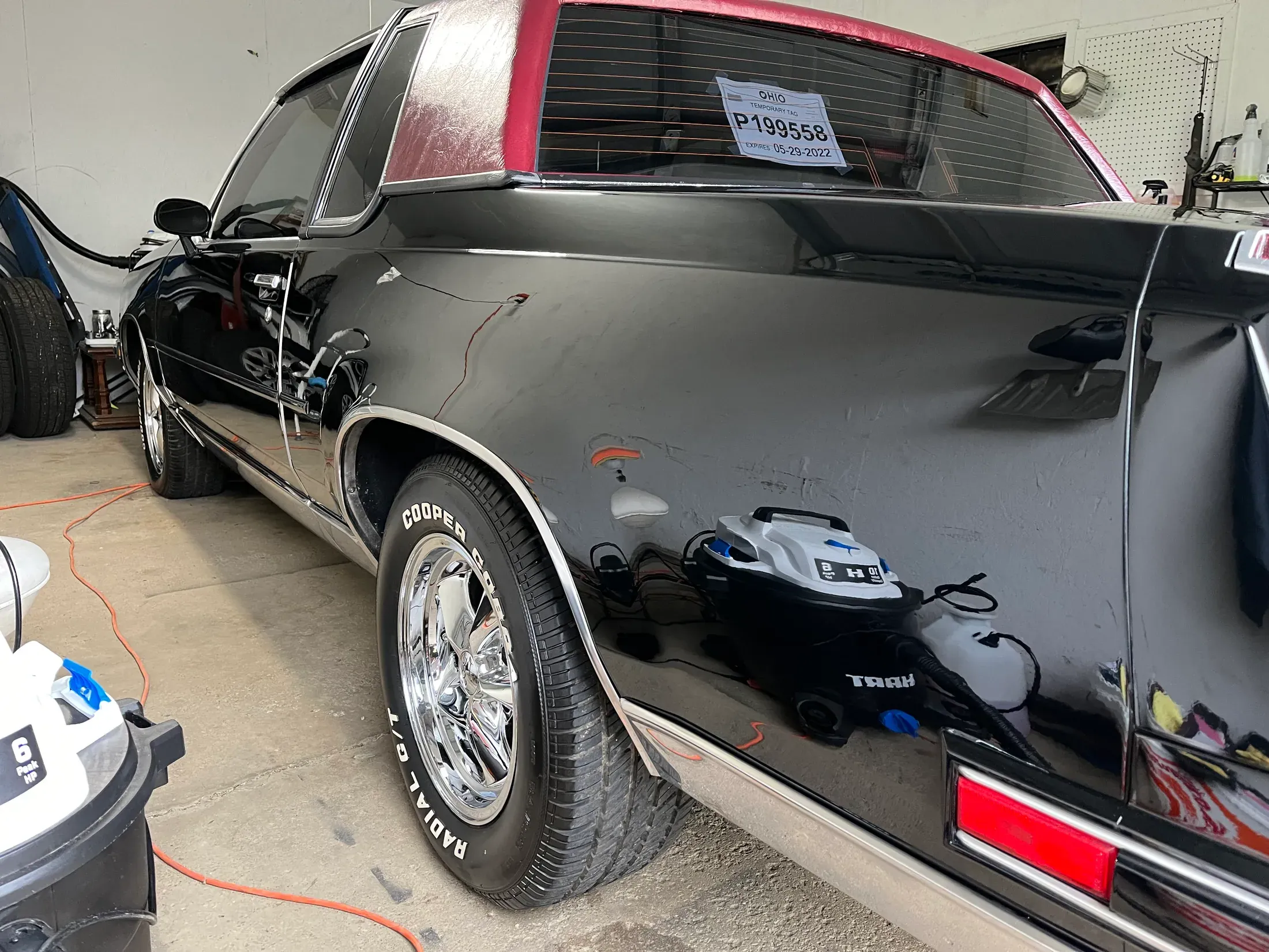 Detailed classic black car from the rear quarter.