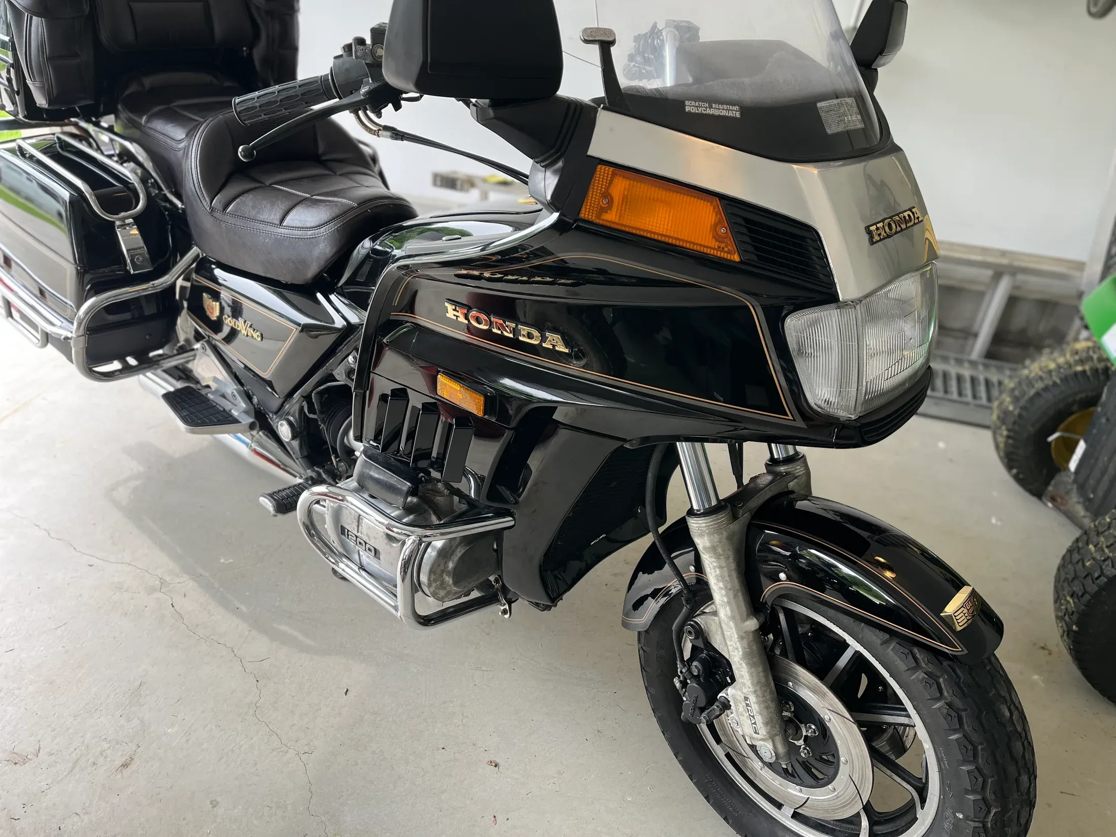 Detailed black and gold Honda Gold Wing touring motorcycle.