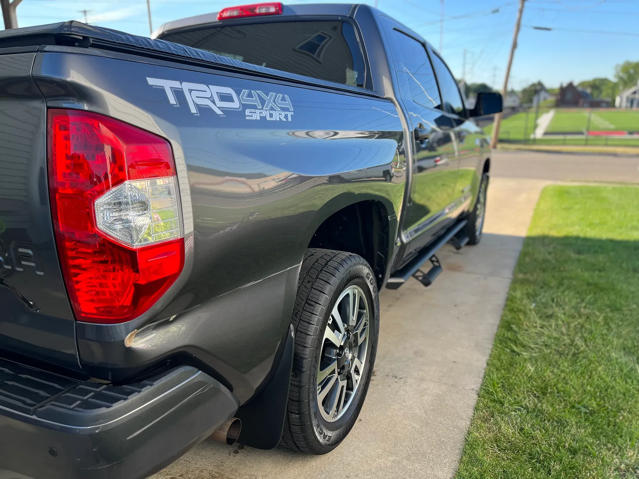Gray Toyota Tundra TRD Sport showing its polished side and rear.