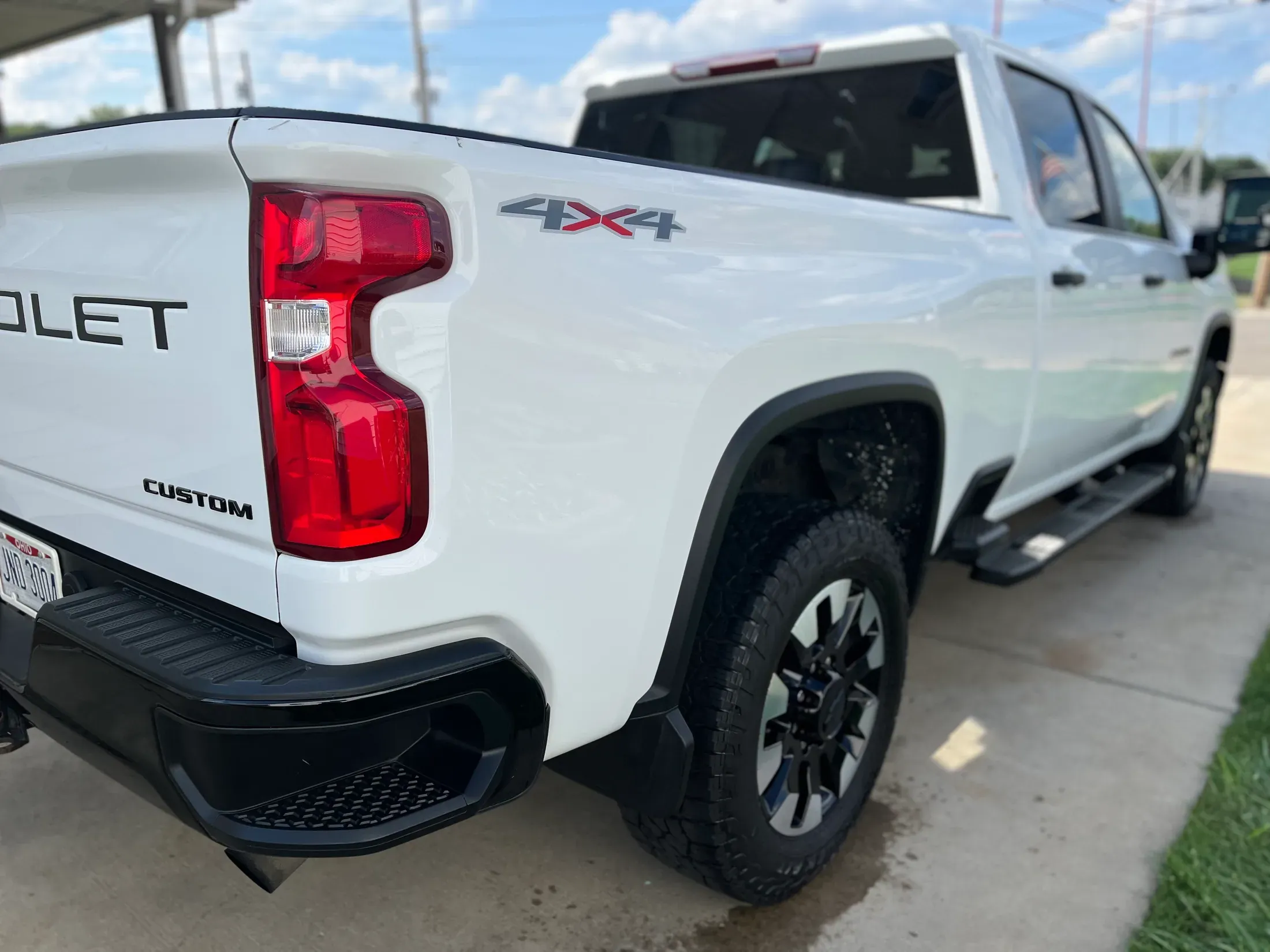 White Chevrolet Silverado HD after detailing, viewed from the front quarter.